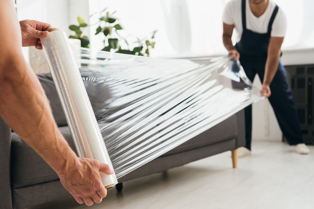 movers preparing the furniture to be sent to the new home