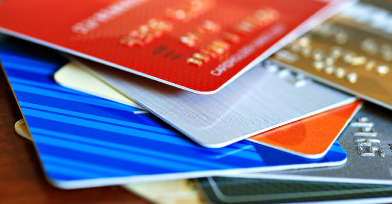 Close-up of a pile of credit cards of different colours