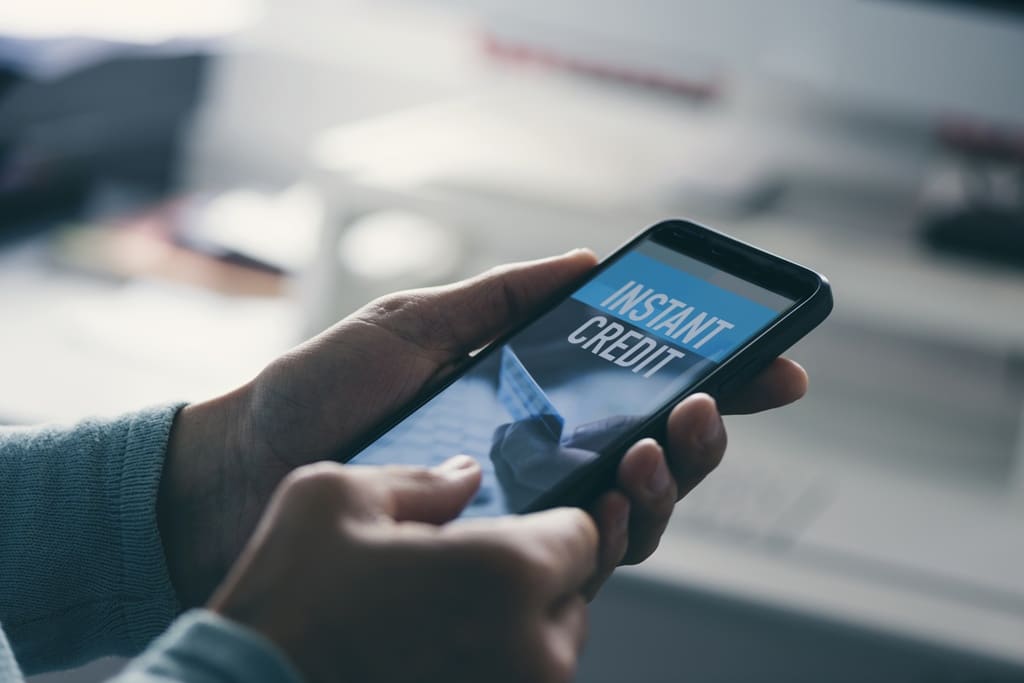 A borrower looking to apply for an instant loan in Singapore through his mobile phone